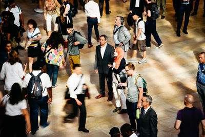 High angle view of people walking on street in city