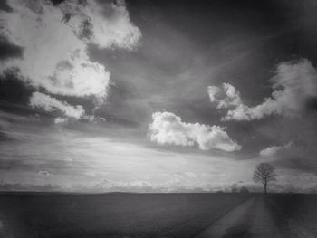 Road against cloudy sky