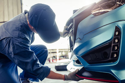 Man working in car