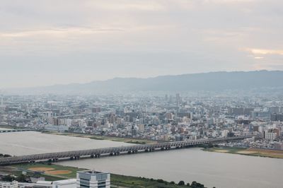 River in city against sky
