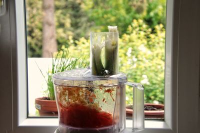 Close-up of kitchen utensil on window