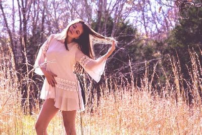 Young woman standing in park