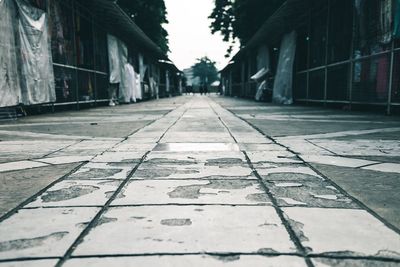 Close-up of cobblestone street in city