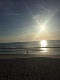 Scenic view of sea against clear sky during sunset