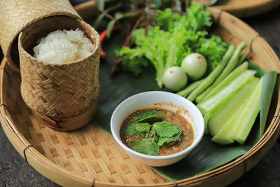 High angle view of vegetables in basket on table