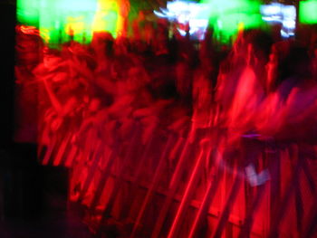 Crowd of people in red light