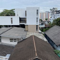 High angle view of buildings in town against sky
