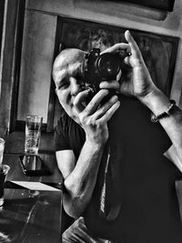 Midsection of man photographing
