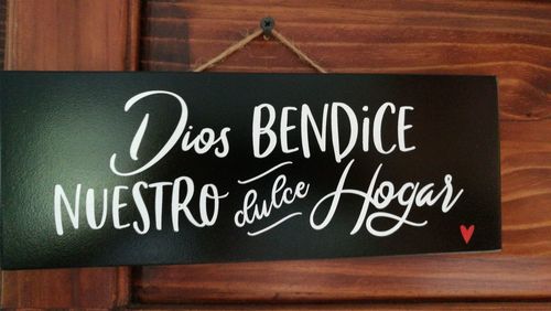 Close-up of information sign on table