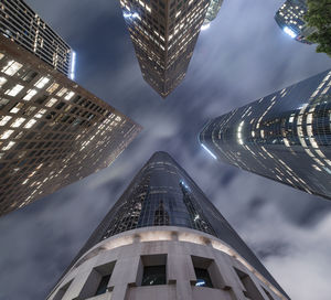 Looking up at skyscrapers in downtown los angeles at night