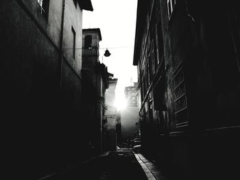 Street amidst buildings against sky