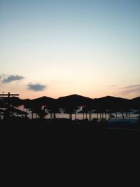 Scenic view of mountains against sky at sunset