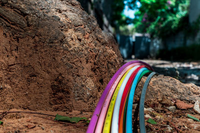 Close-up of multi colored rock on field