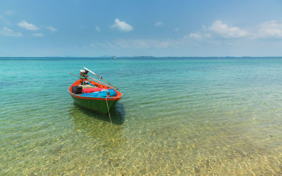 Asian culture boat in sea against sky