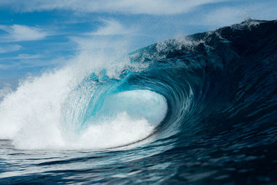 Blue wave breaking on a surf beach in canary islands