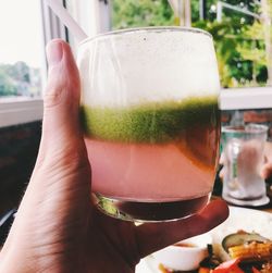 Close-up of hand holding drink