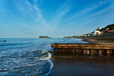 Scenic view of sea against blue sky