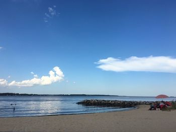 Scenic view of sea against blue sky