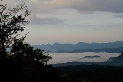 Scenic view of silhouette mountains against sky at sunset