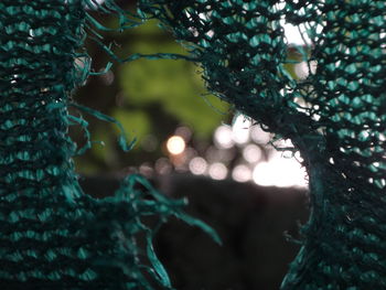 Close-up of torn net outdoors