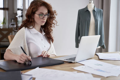 Fashion designer working at office