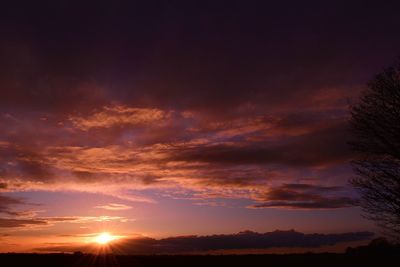 Low angle view of dramatic sky during sunset