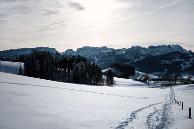 Scenic view of mountains against sky during winter