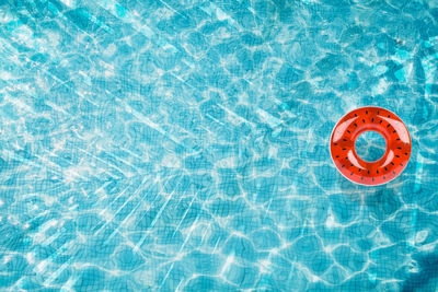 High angle view of painting floating on swimming pool