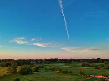 Scenic view of landscape against sky during sunset