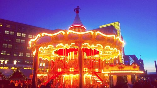 Low angle view of illuminated building at night