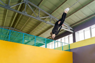 Low angle view of man skateboarding on staircase