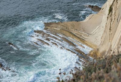 Waves splashing on rocks