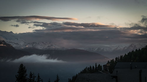 Scenic view of mountains against sky during sunset