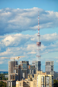 Construction of highrise new building under construction against the background of the city tv tower