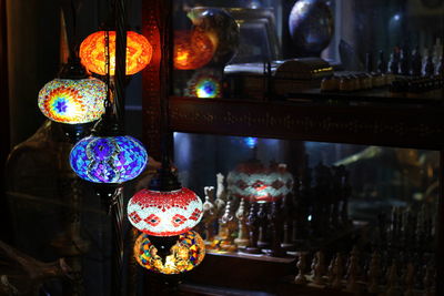 Illuminated lanterns hanging in the dark