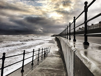 Pier over sea against sky