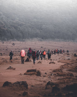 Group of people walking on landscape