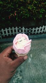 Hand holding ice cream cone