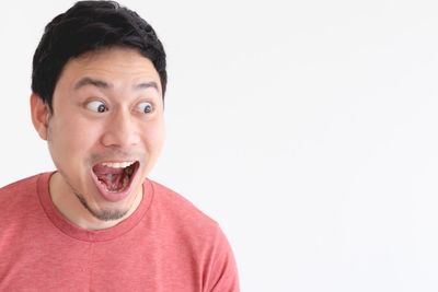 Portrait of mid adult man against white background