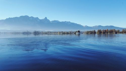 Scenic view of lake against blue sky