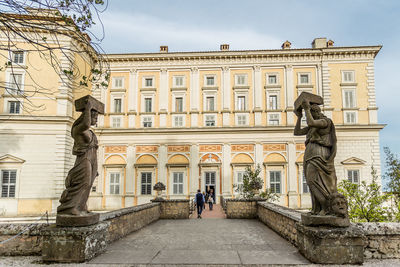 Statue of historic building against sky