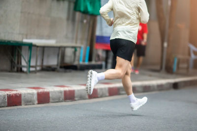 Low section of woman exercising in gym