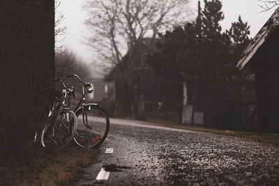 Bicycle parked on road in city