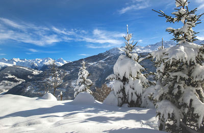 Scenic view of snowcapped mountains against sky