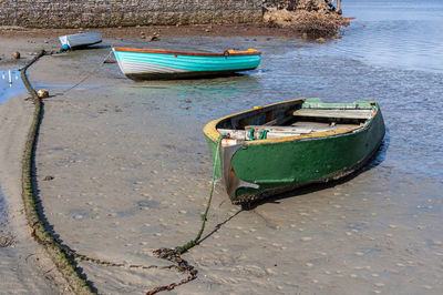 High angle view of fishing boat moored on beach