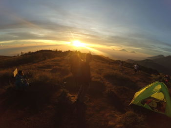 Scenic view of landscape against sky during sunset