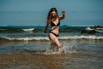 Full length of woman at beach