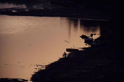 Scenic view of lake during sunset