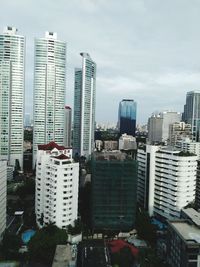Modern buildings in city against sky