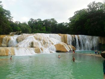 View of waterfall in river